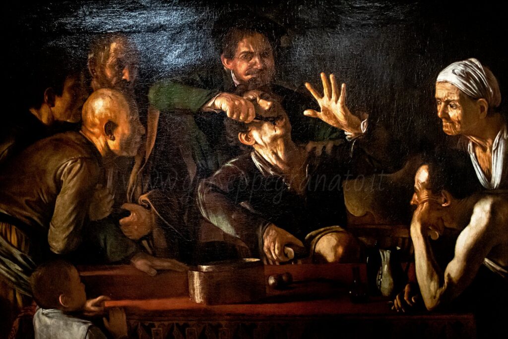 Caravaggio, "Il cavadenti" particolare