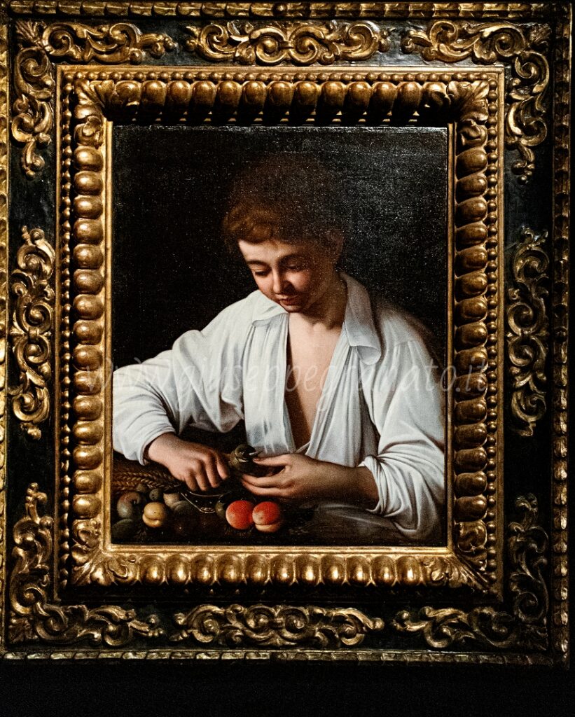 Caravaggio, "Ragazzo che monda un frutto"